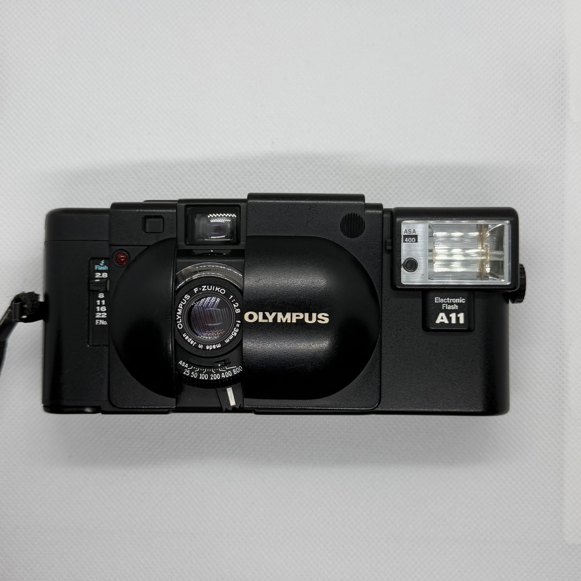 Olympus XA, clamshell open showing F.Zuiko lens